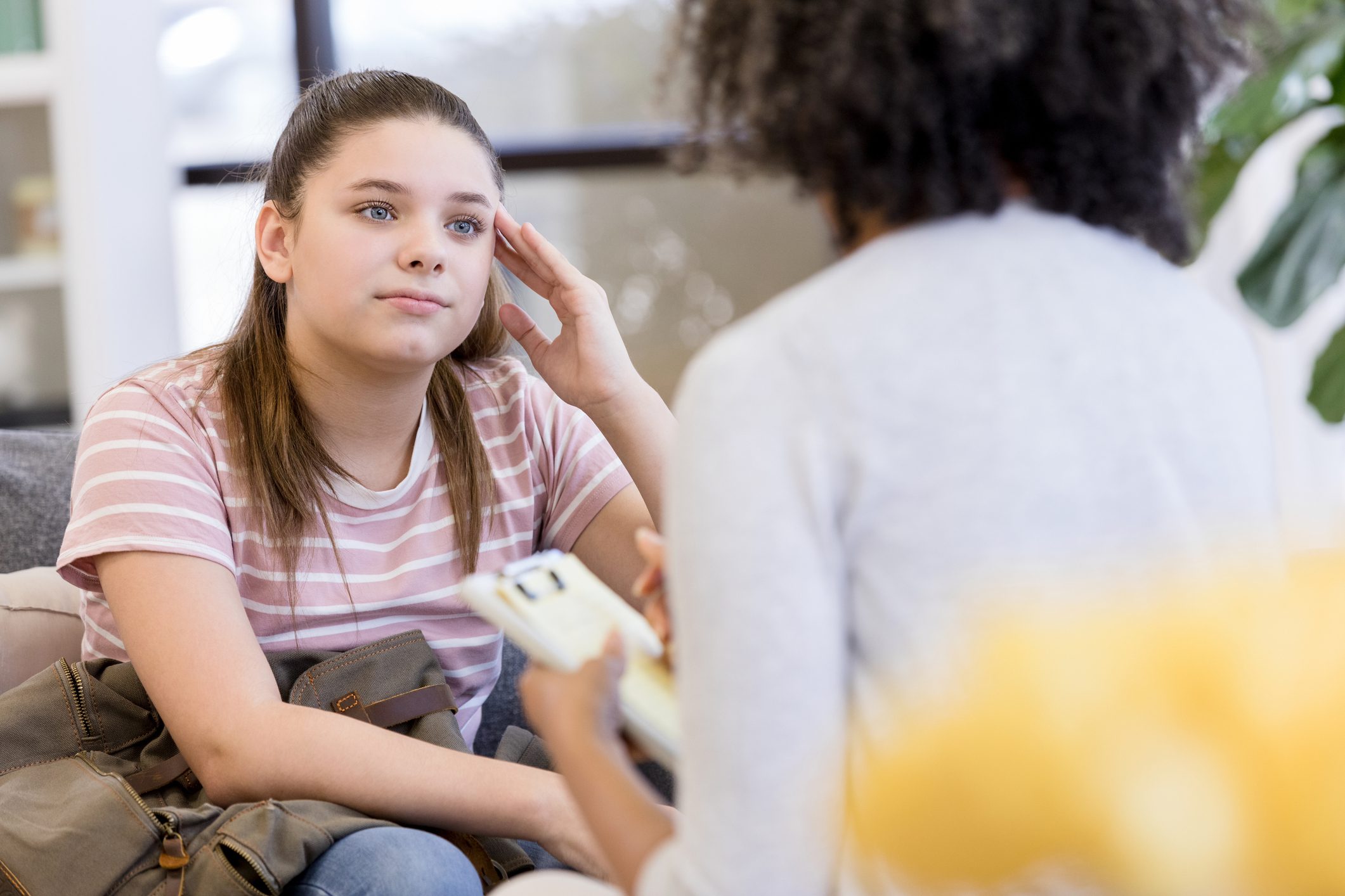 Teen girl upset when confronted by unrecognizable counselor
