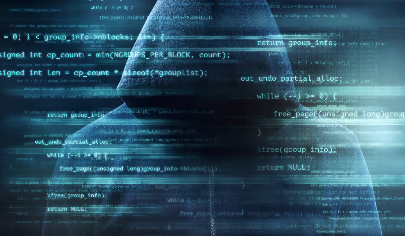 Digitally enhanced shot of computer code superimposed over an unrecognizable man in a hoodie