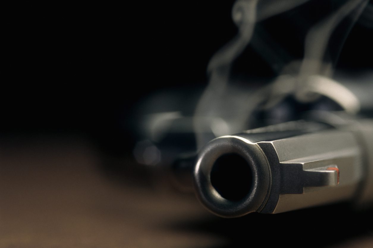Smoking gun lying on the floor, revolver