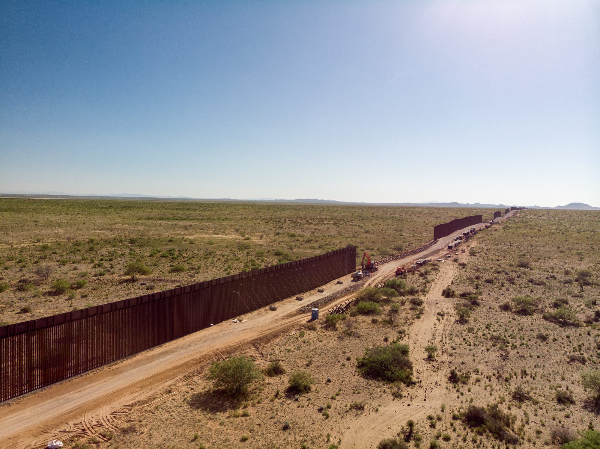 An Aerial View Of The International Border Wall With Portions Still Under Construction