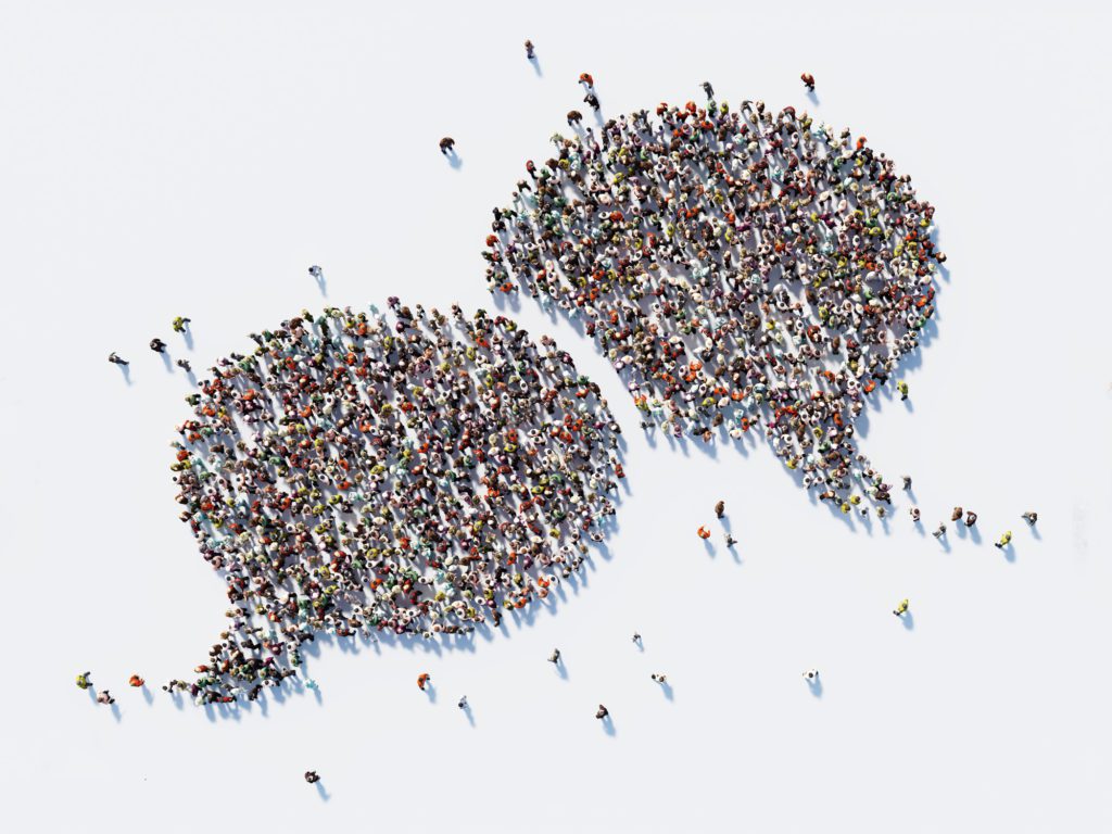 Human Crowd Forming A Big Speech Bubble: Communication And Social Media Concept