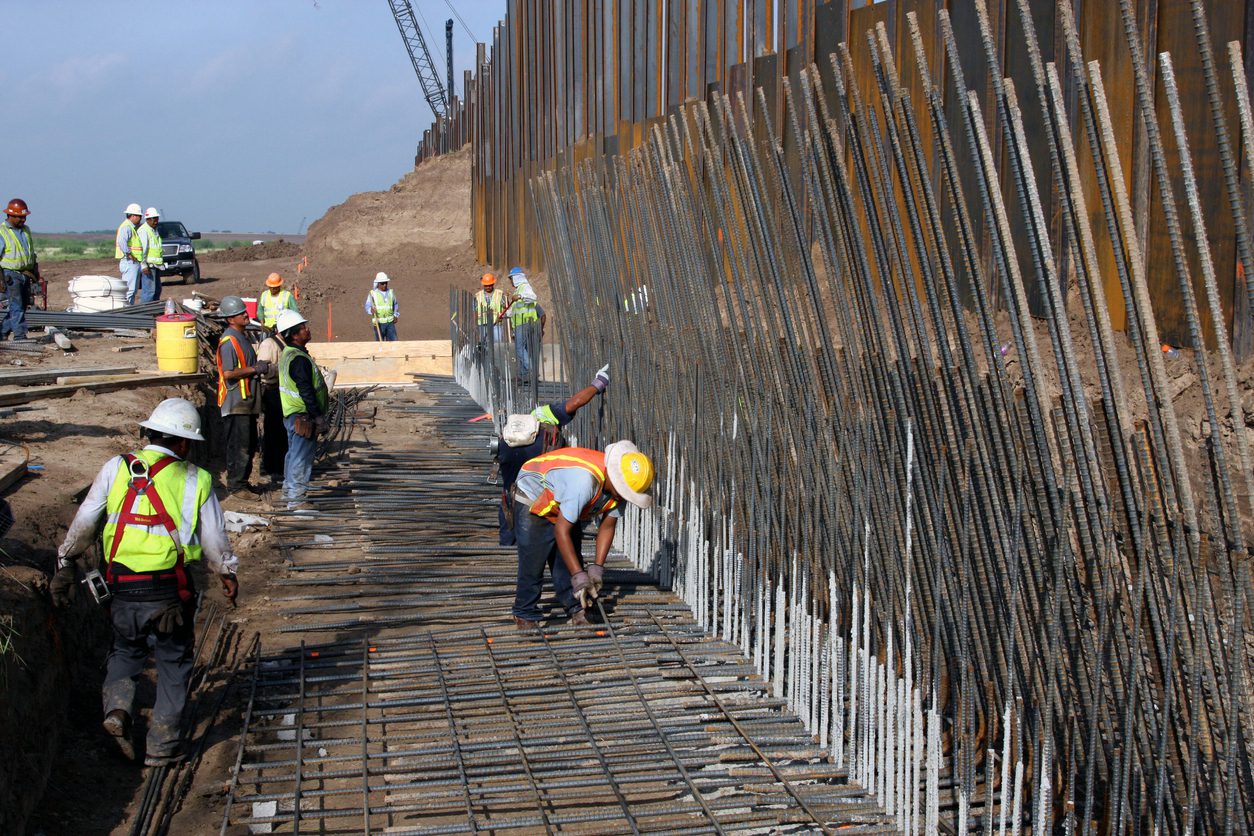 Construction Workers Erecting the Border Wall