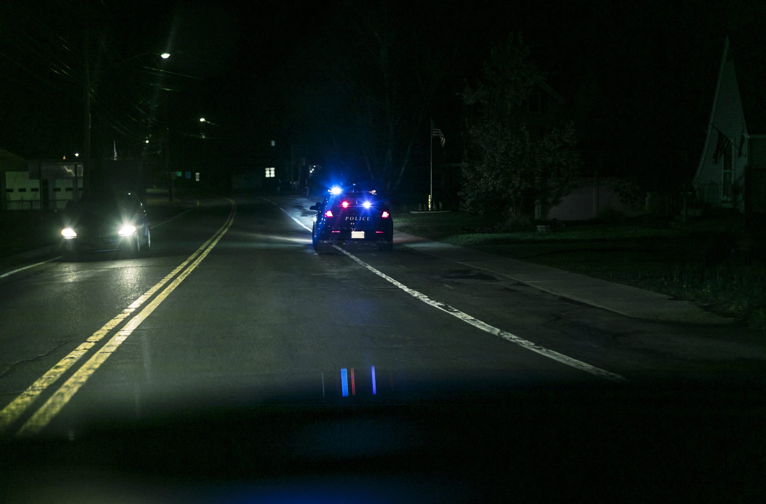 Roadside Car Pulled Over by Police at Night