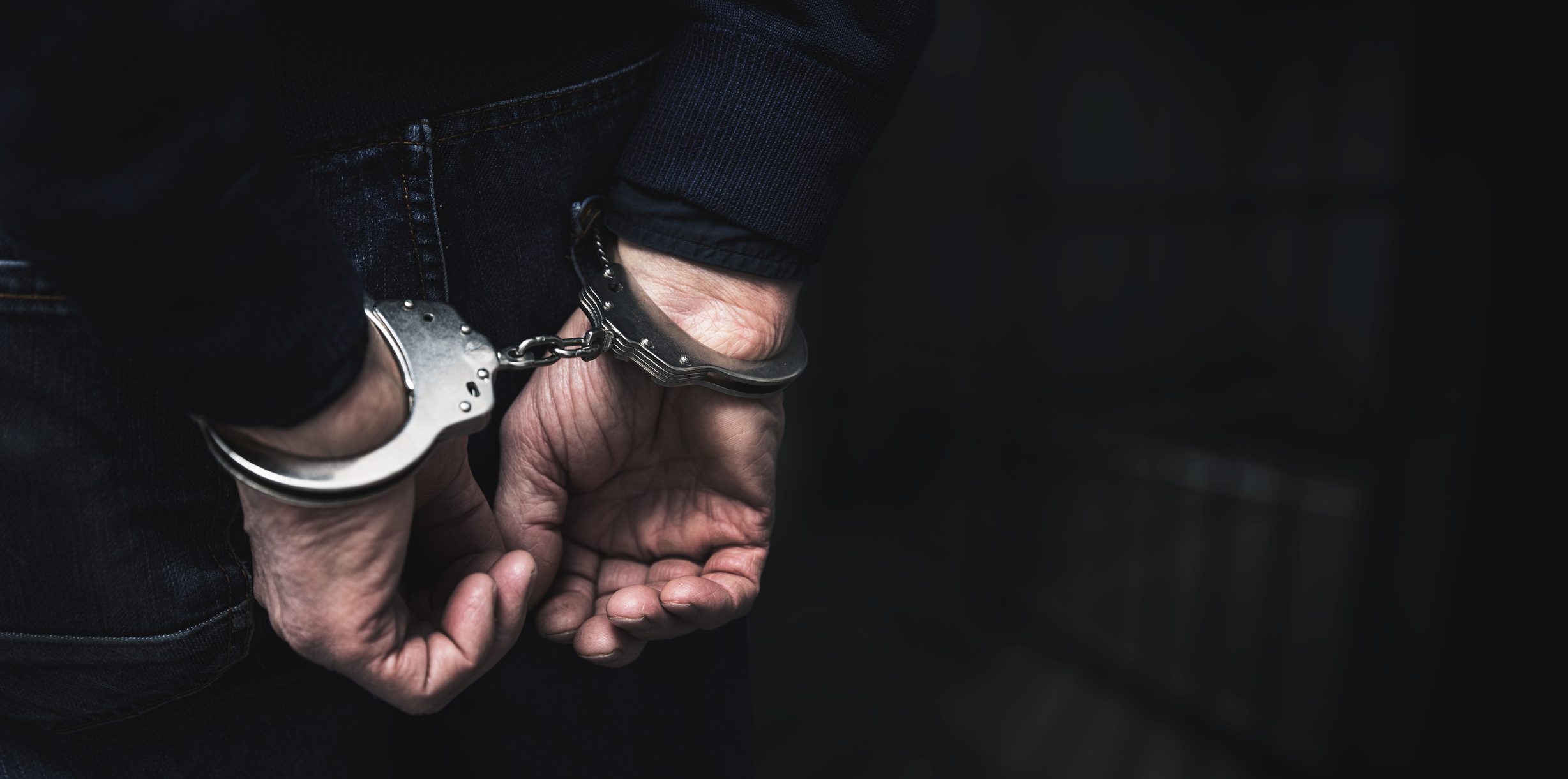 handcuffed arrested man