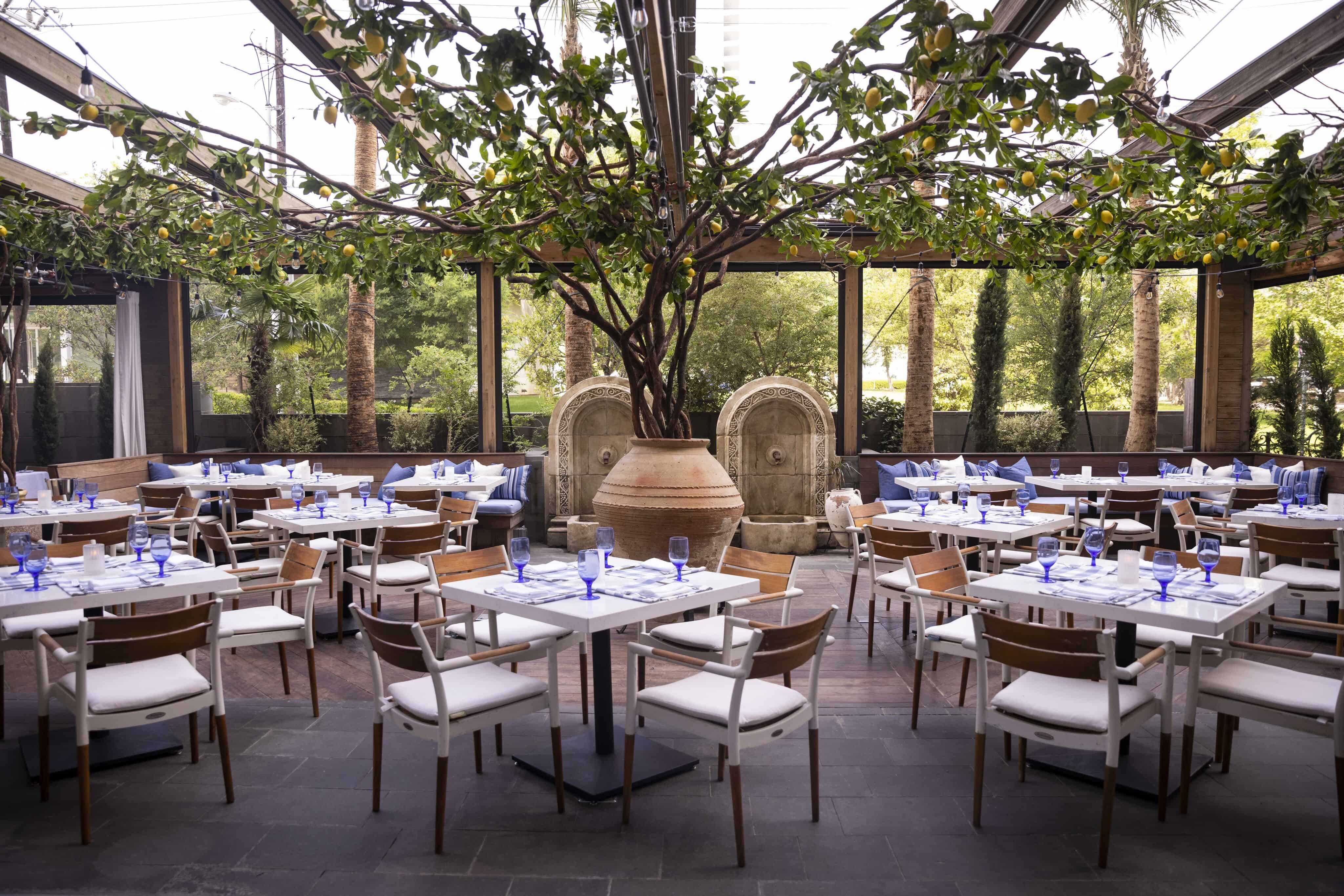 Patio at Dolce Riviera with a faux lemon tree. | Image by Juan Figueroa, The Dallas Morning News
