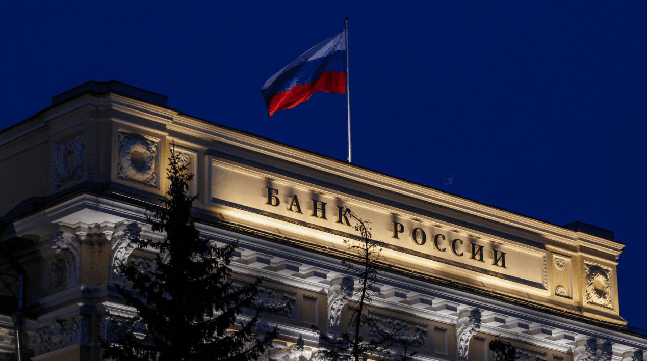 A Russian state flag flies over the Central Bank headquarters in Moscow, Russia