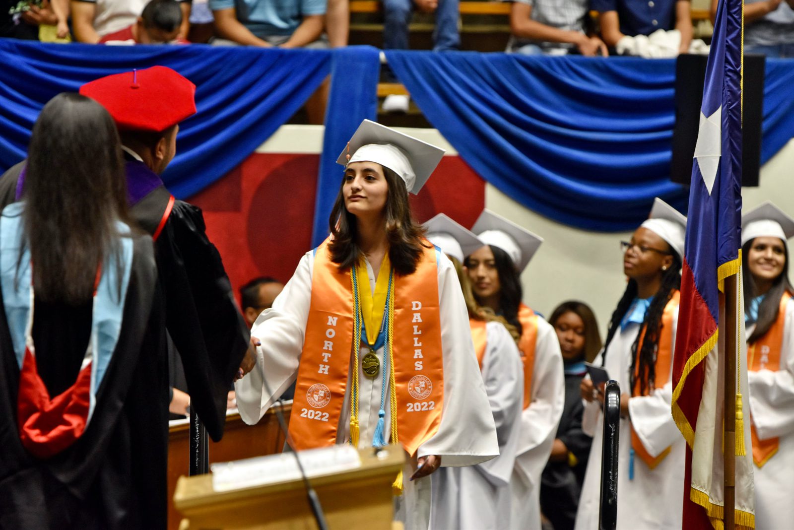 Cindy Gomez leads the procession on stage to receive her diploma.
