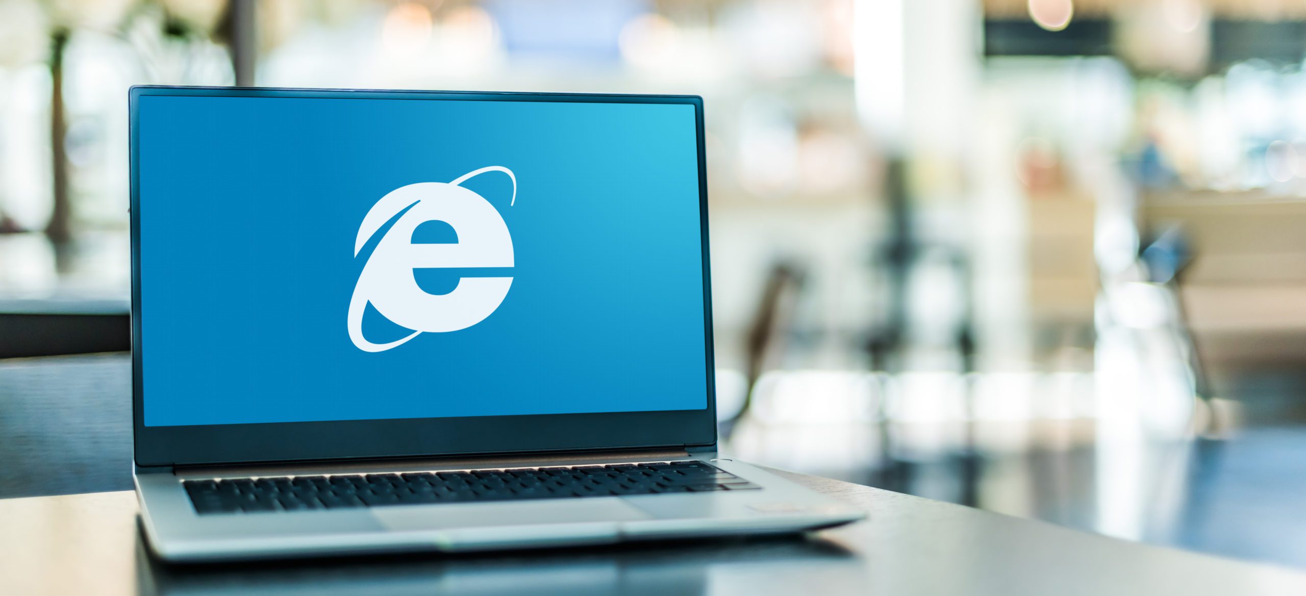 Computer with Internet Explorer logo.