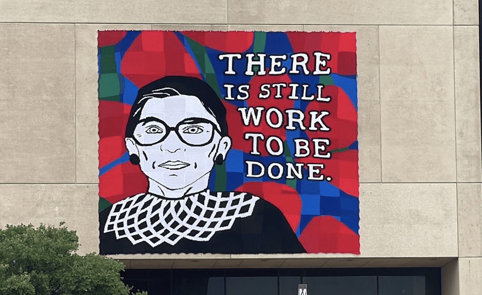 A giant yarn mural honoring Supreme Court Justice Ruth Bader Ginsberg