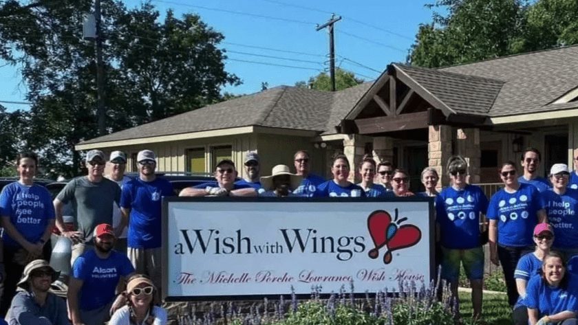 A team of employees from Fort Worth-based Alcon helped clear a lot next to the Wish House