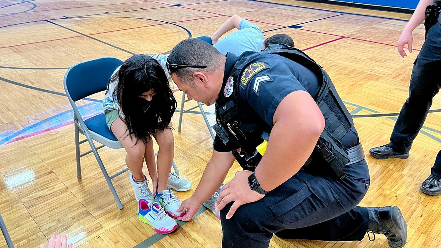 Police Give 500 Kids New Shoes