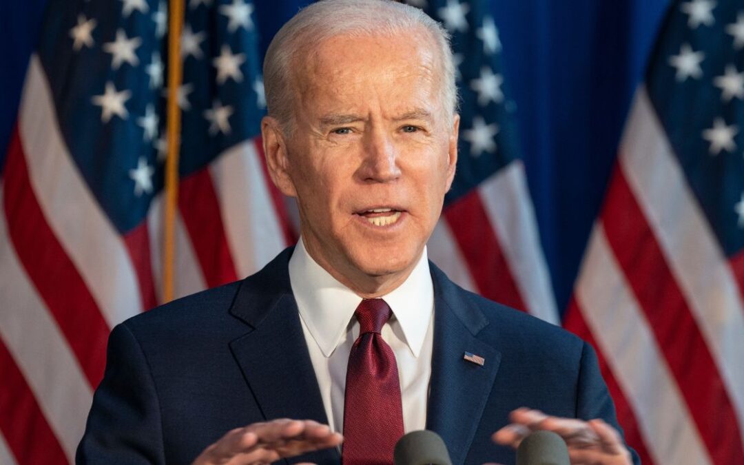 Biden Strikes Conciliatory Note After Signing