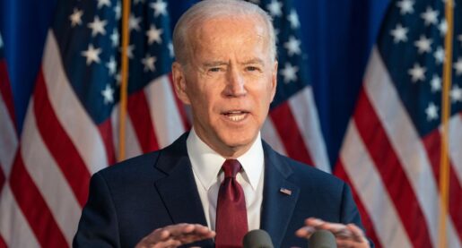 Biden Strikes Conciliatory Note After Signing
