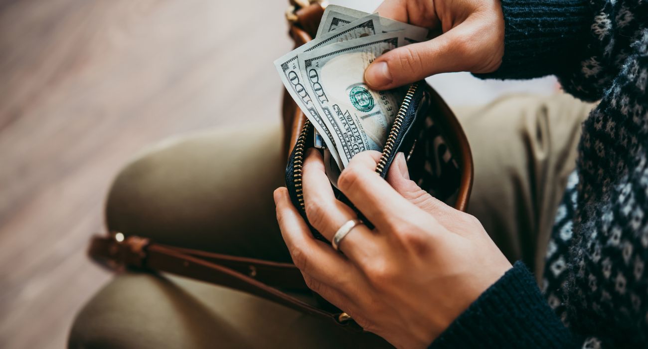 Woman pulling money out of purse