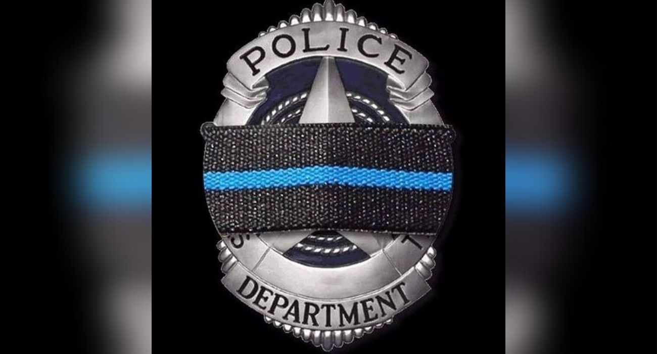 Dallas Police badge with mourning band