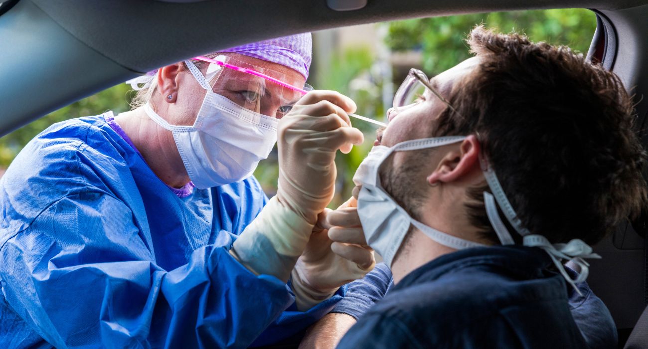 doctor taking a nasal swab from a person