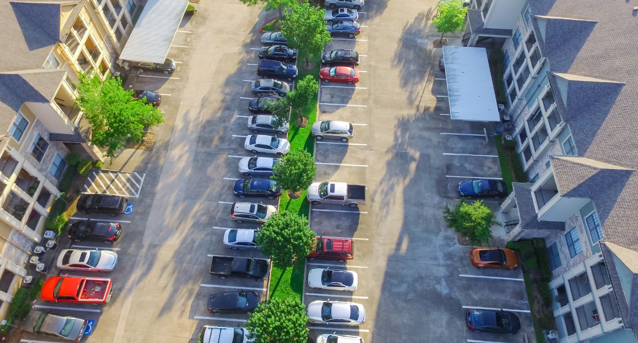 Aerial view of parking lot at apartment complex