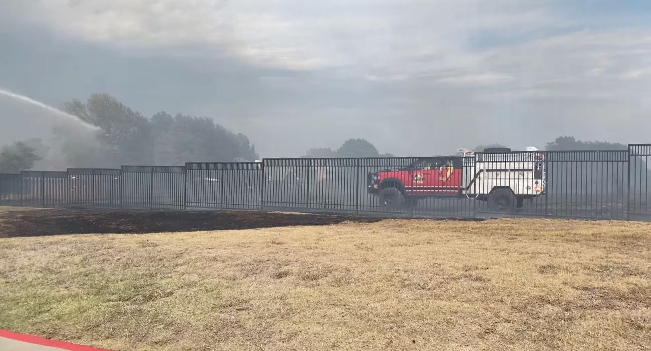 firefighters spraying burned areas