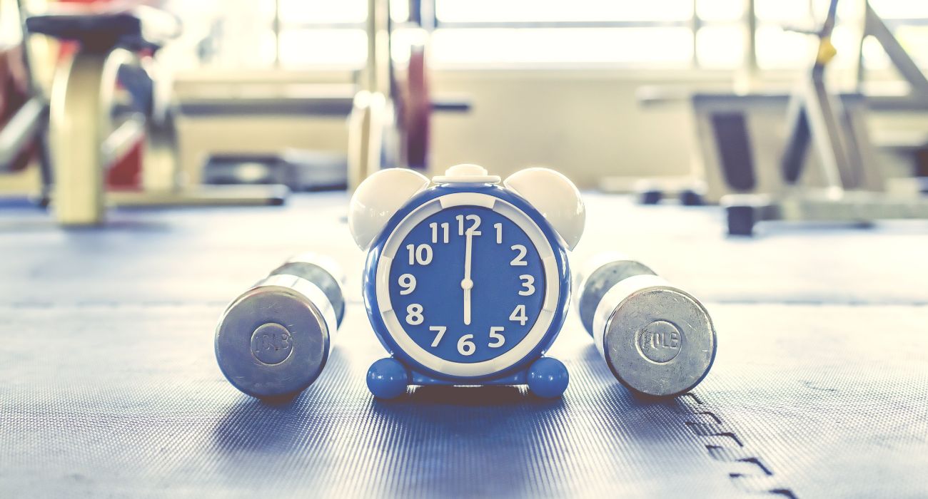 Alarm clock with exercise equipment