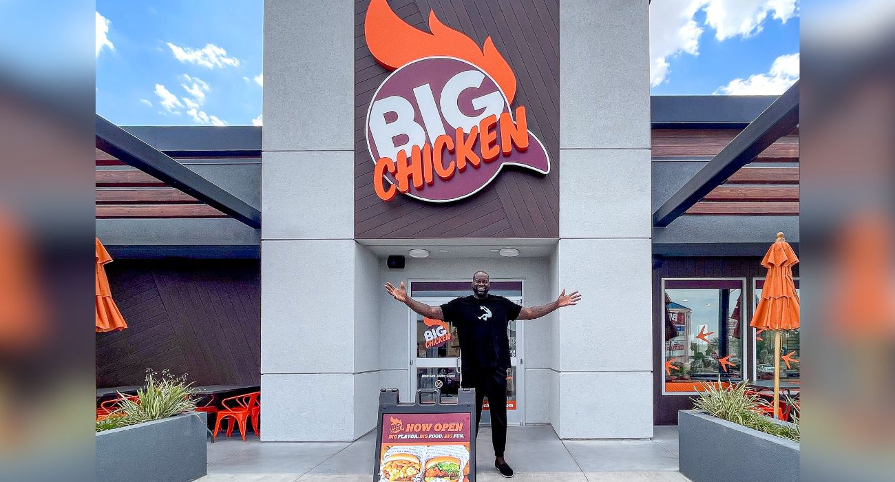Shaquille O'Neal stands in front of one of his Big Chicken restaurants