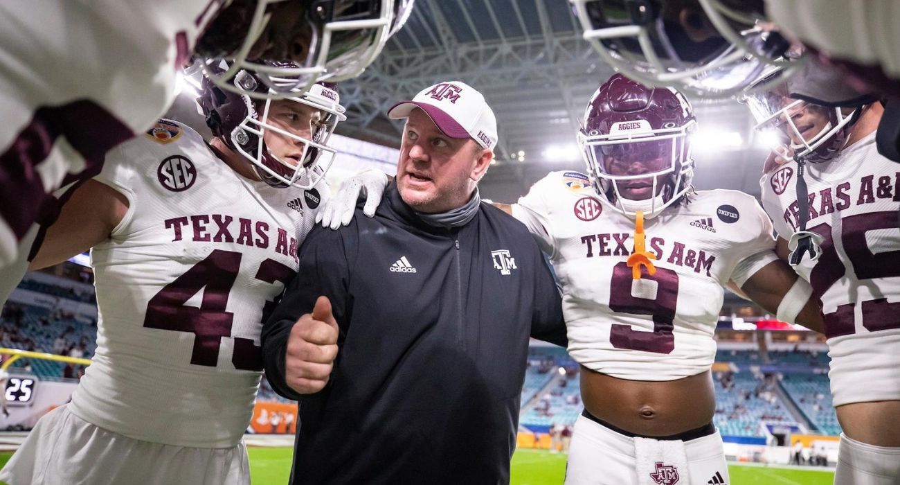 Mike Elko with Texas A&M players