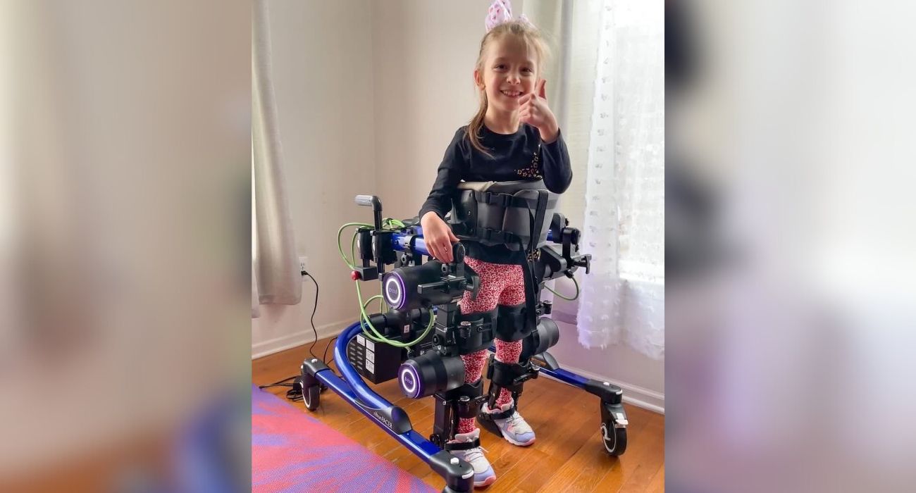Briella walks with her Trexo walker and takes independent steps.