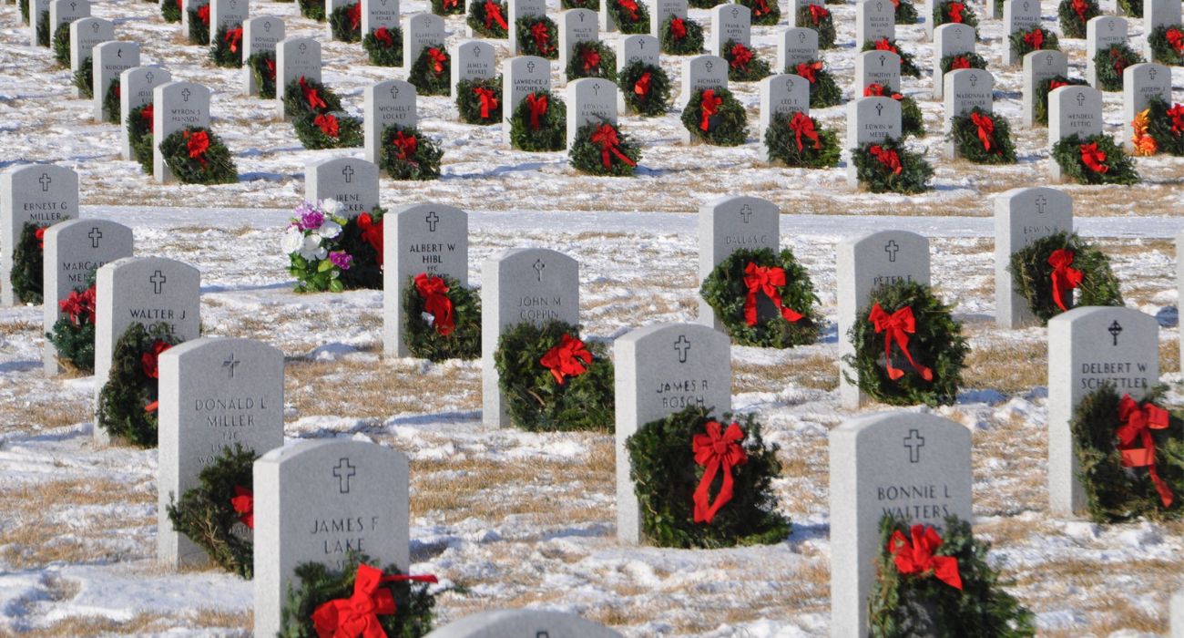 Wreaths laid on gravestones of service men and women.