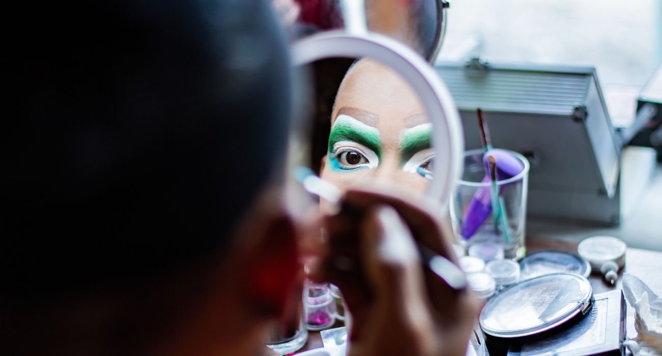 Drag queen putting on makeup