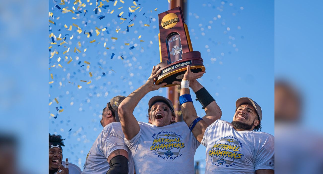 South Dakota State Jackrabbits players hold up trophy