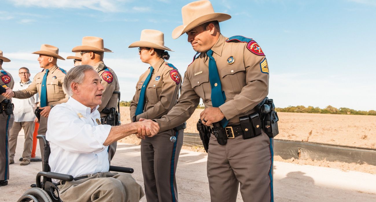 Texas Gov. Greg Abbott shakes hands with Texas DPS troopers