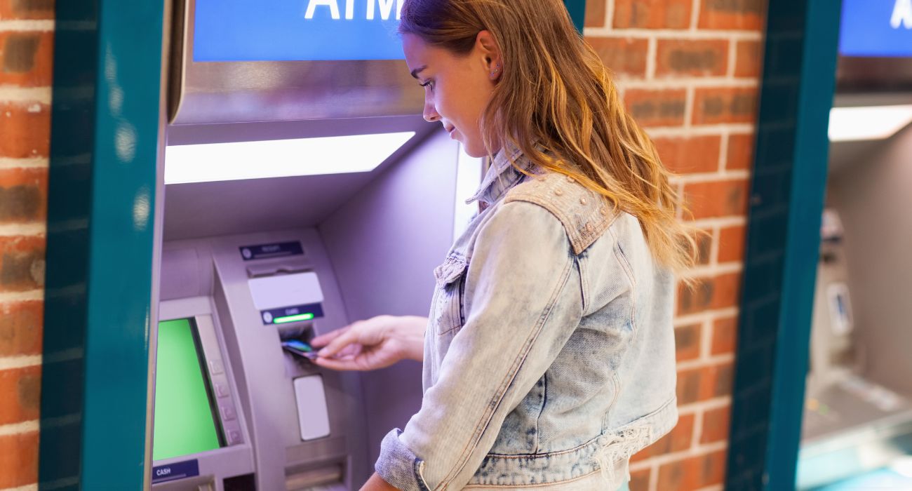 Woman at ATM machine