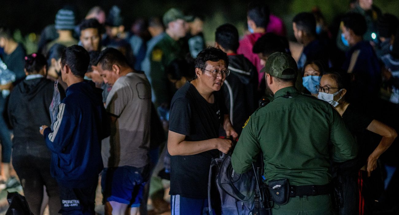 U.S. Border Patrol with unlawful Chinese migrants at the border.