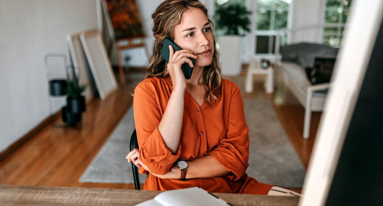 Woman working remote and talking on phone