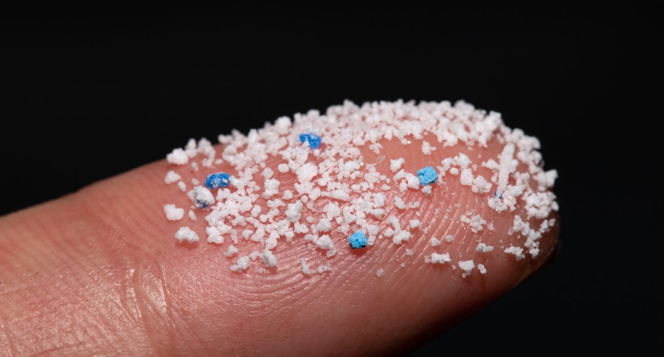 Small Plastic pellets on a finger