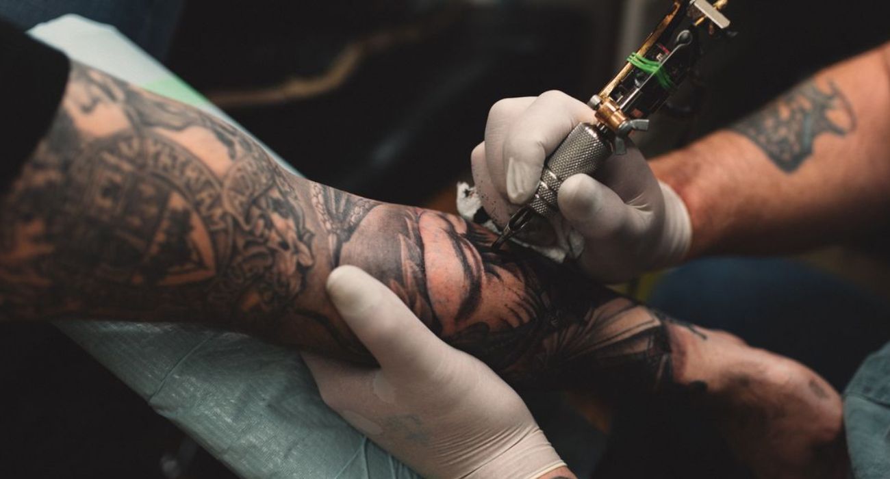 Tattoo artist giving a tattoo