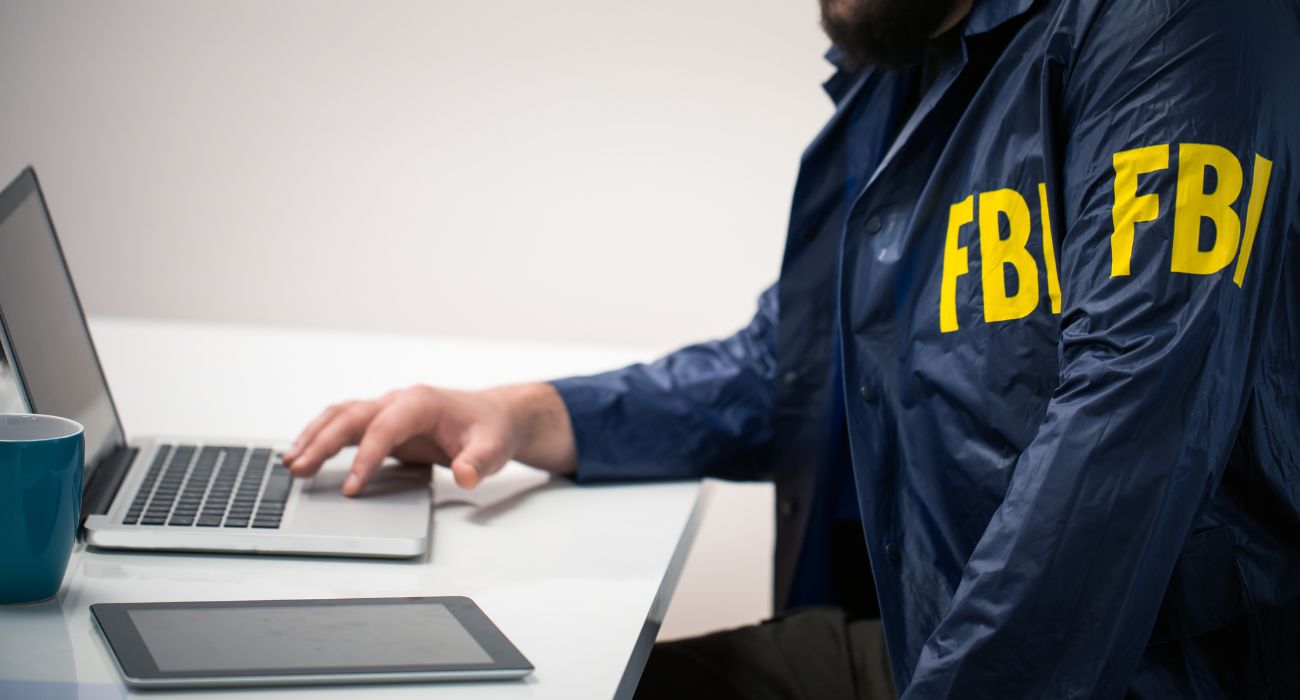 FBI agent using a laptop