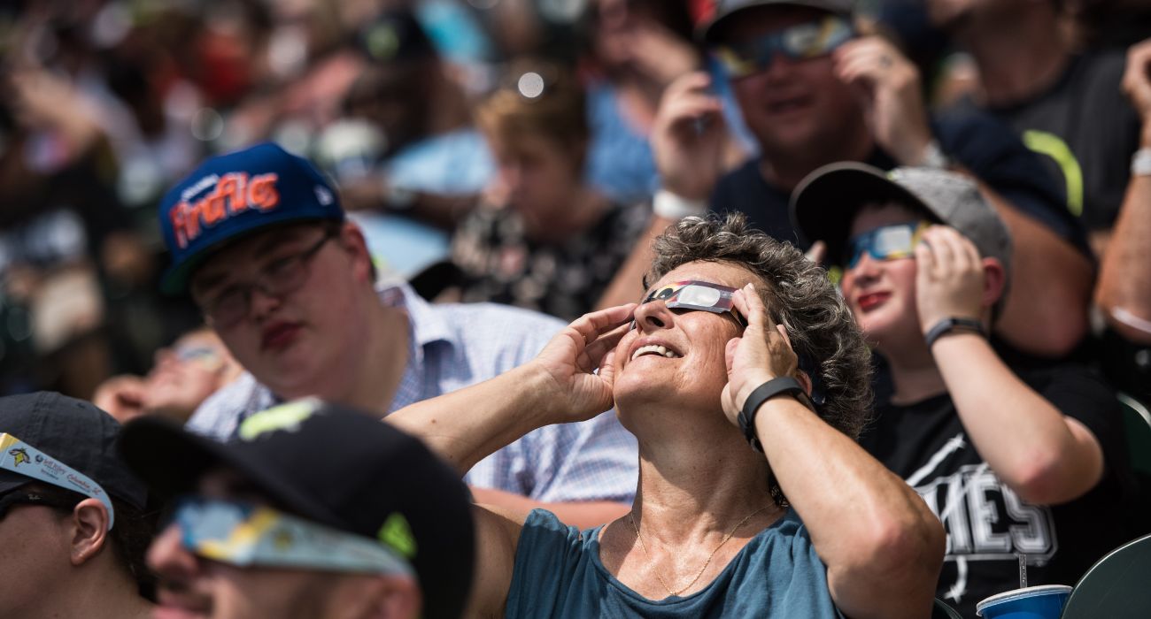 People looking at solar eclipse