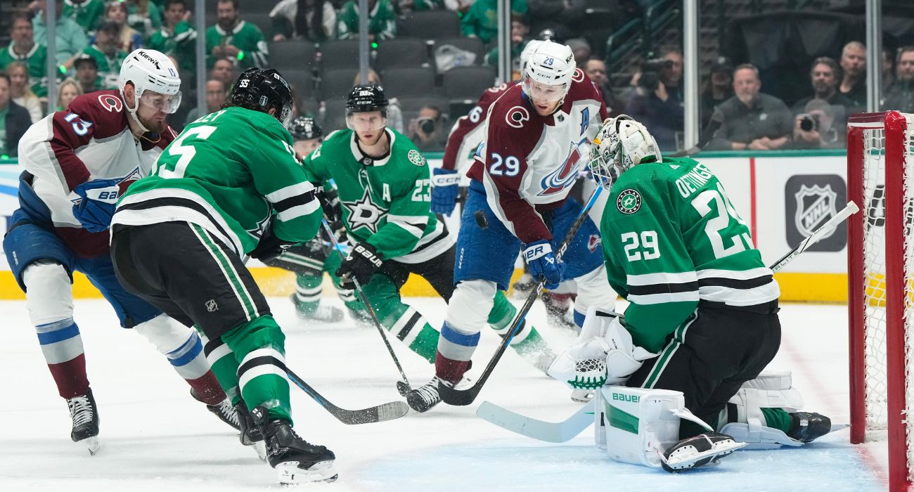 Nathan MacKinnon #29 of the Colorado Avalanche fights for the puck against Jake Oettinger #29 of the Dallas Stars | Image by Sam Hodde/Getty Images
