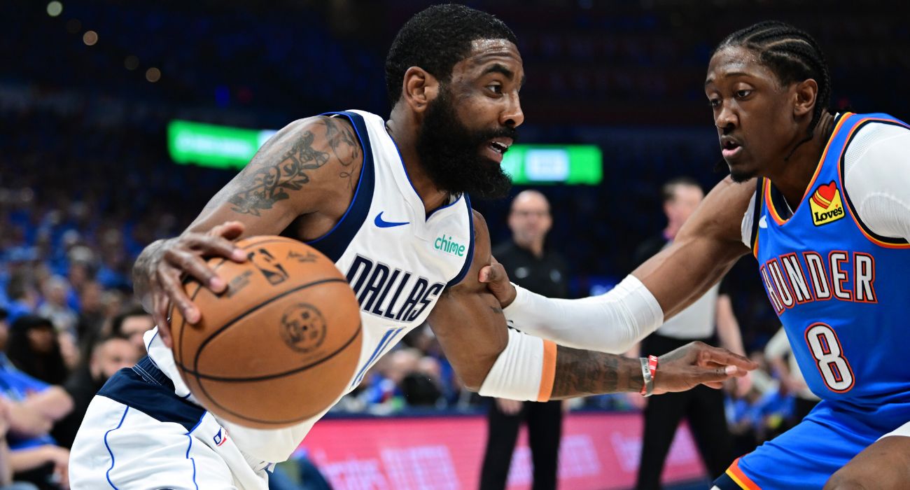 Kyrie Irving #11 of the Dallas Mavericks drives to the basket against Jalen Williams #8 of the Oklahoma City Thunder | Image by Joshua Gateley/Getty Images