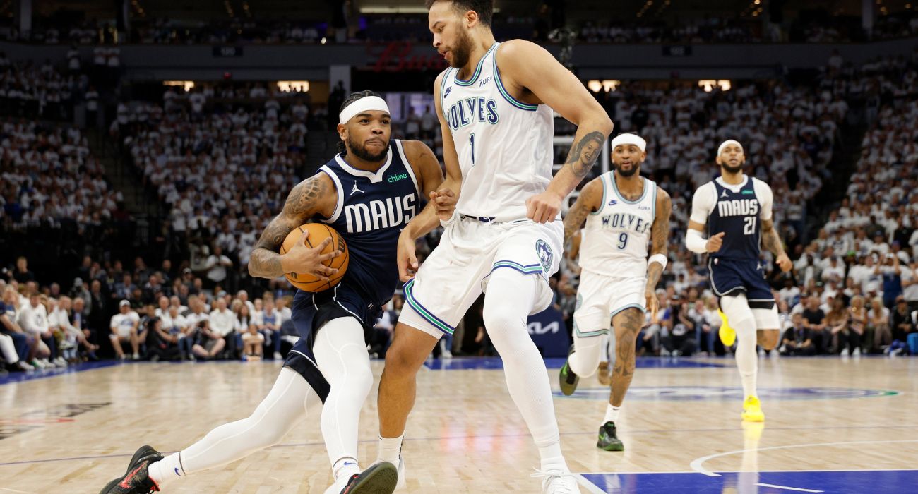 Jaden Hardy #1 of the Dallas Mavericks drives to the basket against Kyle Anderson #1 of the Minnesota Timberwolves | Image by David Berding/Getty Images