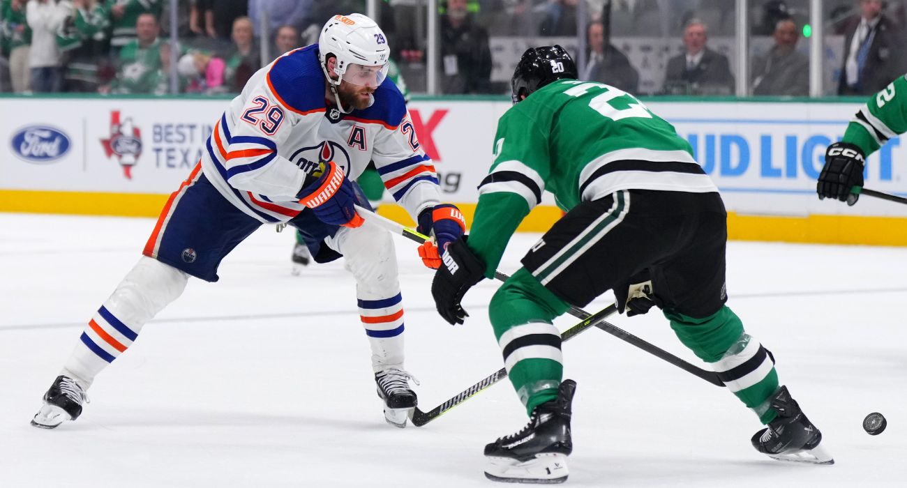 Leon Draisaitl #29 of the Oilers skates against Ryan Suter #20 of the Stars during overtime in Game One of the WCF of the 2024 Stanley Cup Playoffs on May 23, 2024. | Image by Cooper Neill/Getty Images