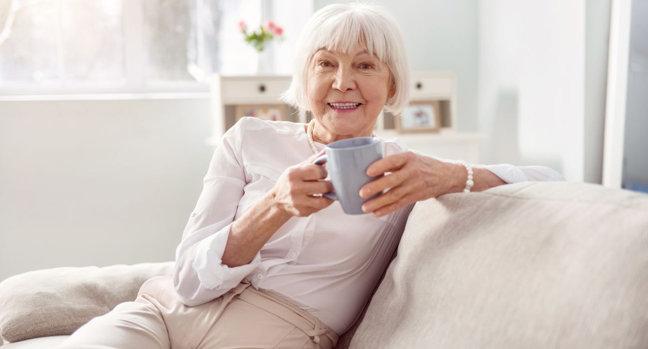 Cheerful woman with mug