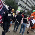 Antifa Member Identified At Dallas “No Kings” Rally, Waving Flag And Leading March