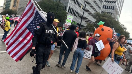 Antifa Member Identified At Dallas “No Kings” Rally, Waving Flag And Leading March