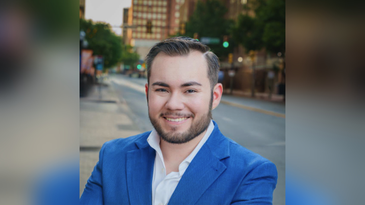 The Dallas Express investigative reporter Carlos Turcios wearing a blue blazer.